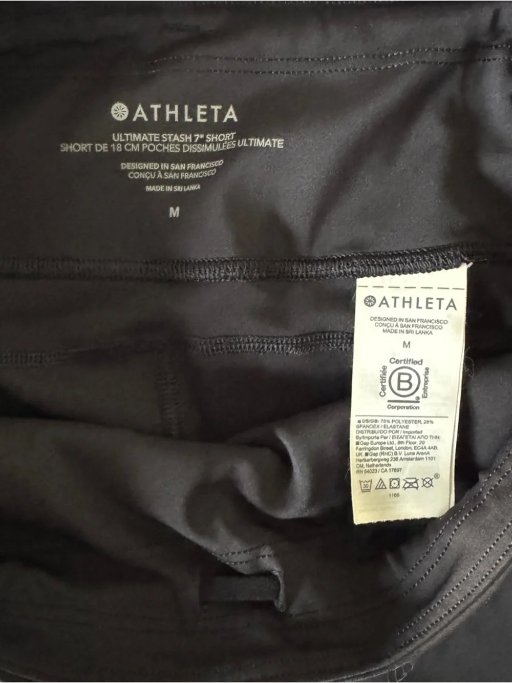 Athleta Ultimate Stash Black High-Rise Bike Shorts with Side Pockets - Picture 3 of 4